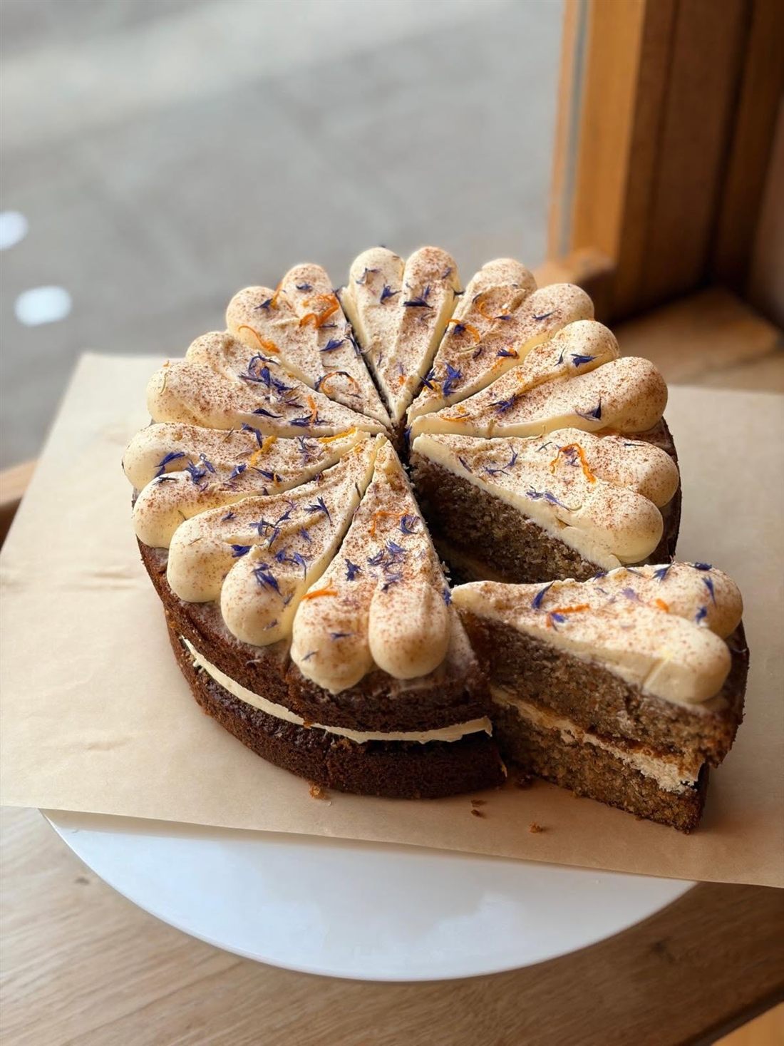Layer cake with cream rosettes and crumb