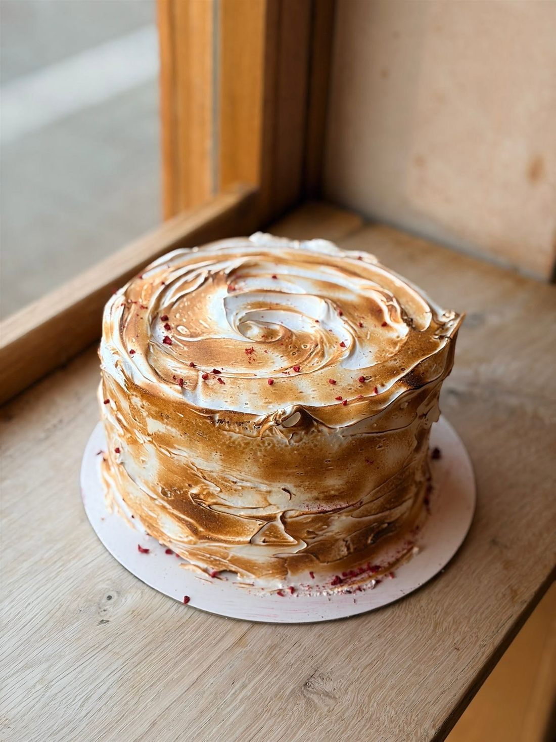 Cake covered in torched meringue