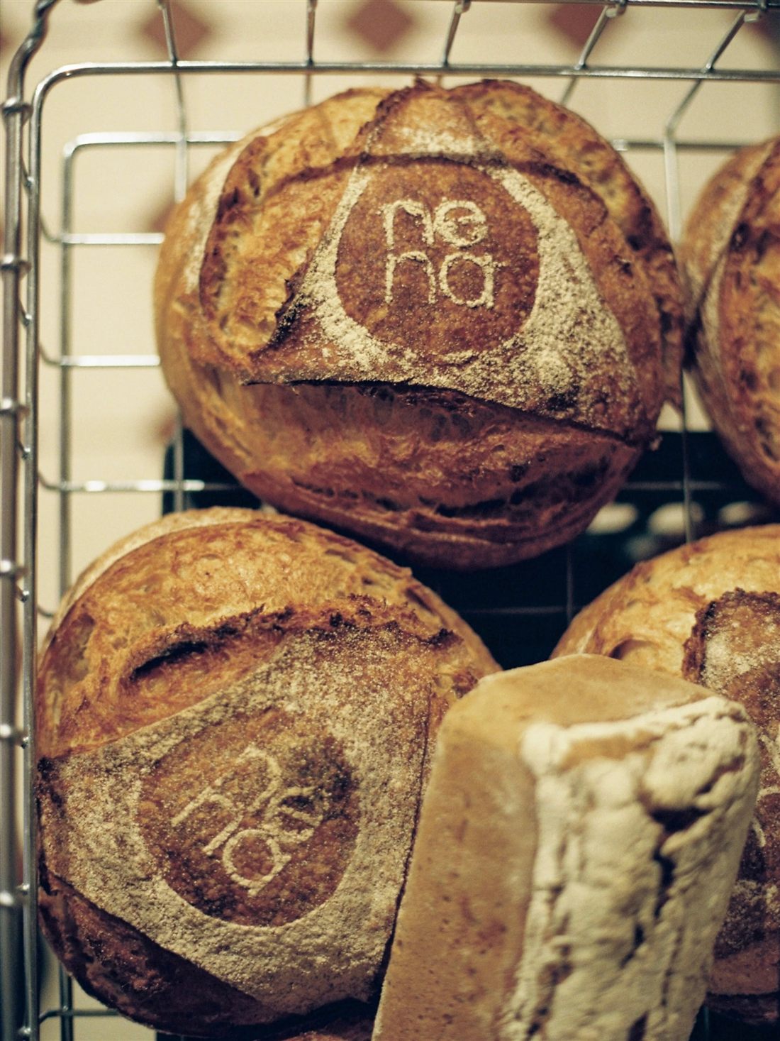 Sourdough loaves stamped with the Nena logo